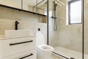 Shower, hair dryer, towels, soap