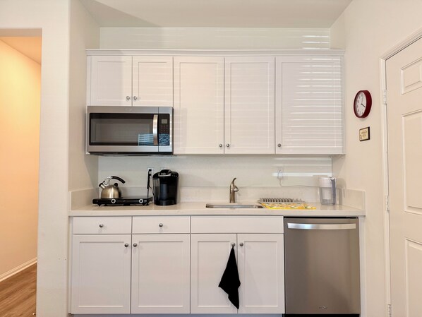 Fridge, microwave, stovetop, coffee/tea maker