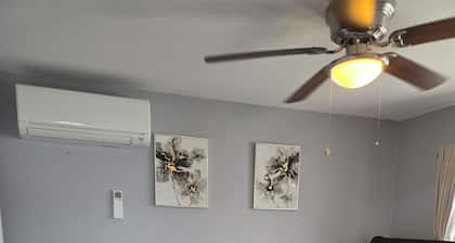 Tranquil room and bathroom in a house with AC and central heating system