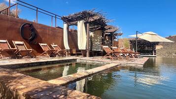 Outdoor pool, open 10:00 AM to 10:00 PM, free cabanas, pool umbrellas