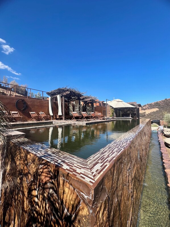 Outdoor pool, open 10:00 AM to 10:00 PM, free pool cabanas
