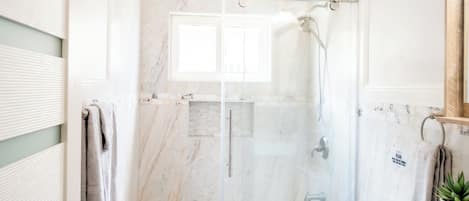 Shower, hair dryer, towels, soap