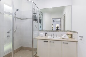 Shower, hair dryer, towels, soap