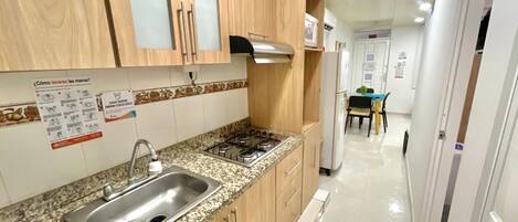 Fridge, microwave, stovetop, coffee/tea maker