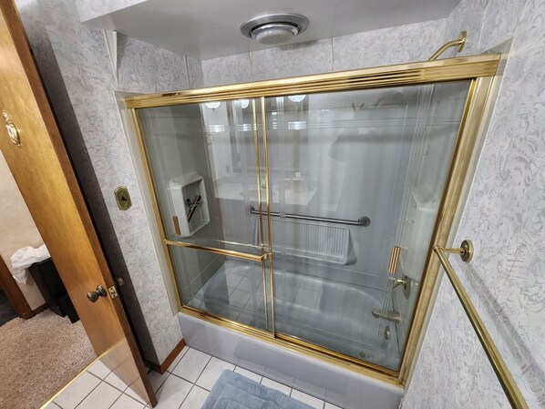 Shower, hair dryer, towels, soap