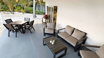 Family Bungalow, 2 Bedrooms, Lagoon View, Beachfront | Living area | 55-inch Smart TV with satellite channels