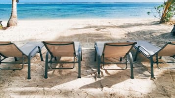 Private beach, white sand, sun loungers, beach towels
