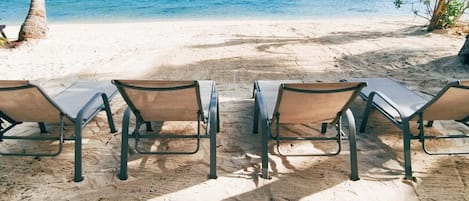 Private beach, white sand, sun loungers, beach towels