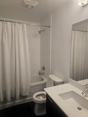 Hair dryer, towels, soap, toilet paper