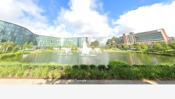 A modern building with a glass facade and a fountain in the foreground. - Steps from Shands. Ready for Rotations: Mid-July and October Rotations Available (Gainesville)