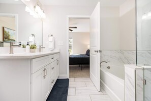 Shower, hair dryer, towels, shampoo