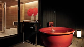 Executive Suite | Bathroom | Hair dryer, slippers, towels, soap