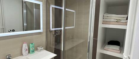 Shower, free toiletries, hair dryer, slippers