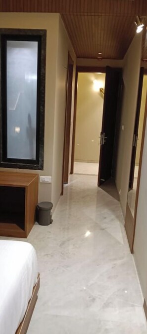 Deluxe Room | Desk, laptop workspace, iron/ironing board, free WiFi - Hotel Tanishka INN (Mathura)