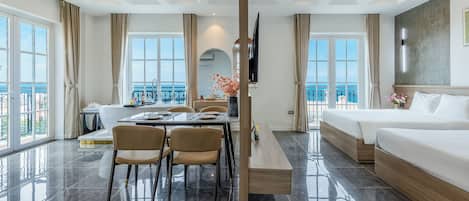 Deluxe Quadruple Room, Balcony, Beach View | Desk, laptop workspace, soundproofing, free WiFi