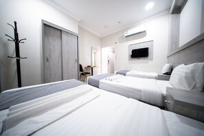 Triple Room | Minibar, blackout curtains, iron/ironing board, free WiFi
