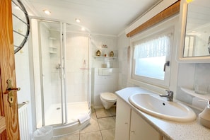Shower, hair dryer, towels