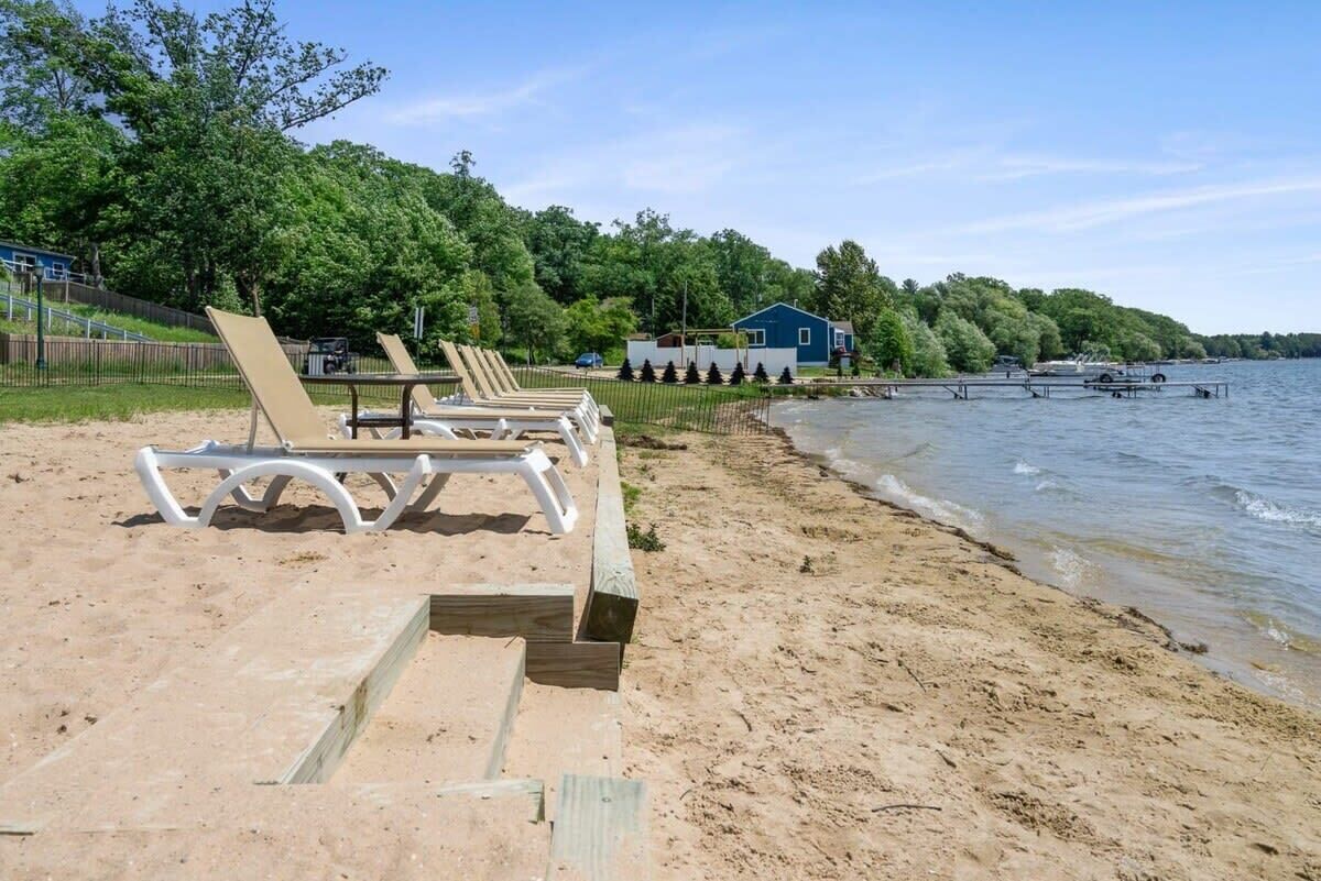 Steps down to the sandy private beach area