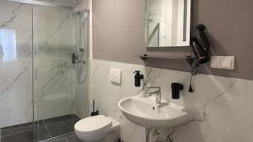 Shower, hair dryer, towels, soap