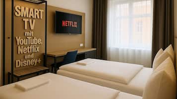 Edredón, escritorio, wifi gratis y ropa de cama