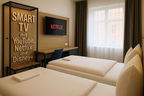 Donsdekens, een bureau, gratis wifi, beddengoed