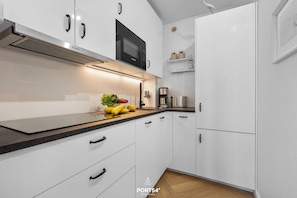 Fridge, microwave, stovetop, coffee/tea maker