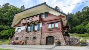 A stone building with a sign reading 'Pension Alice Serbe.' - Double Room No. 2 with Shared Terrace, Shared Garden and Wi-Fi (Dachsberg (Südschwarzwald))