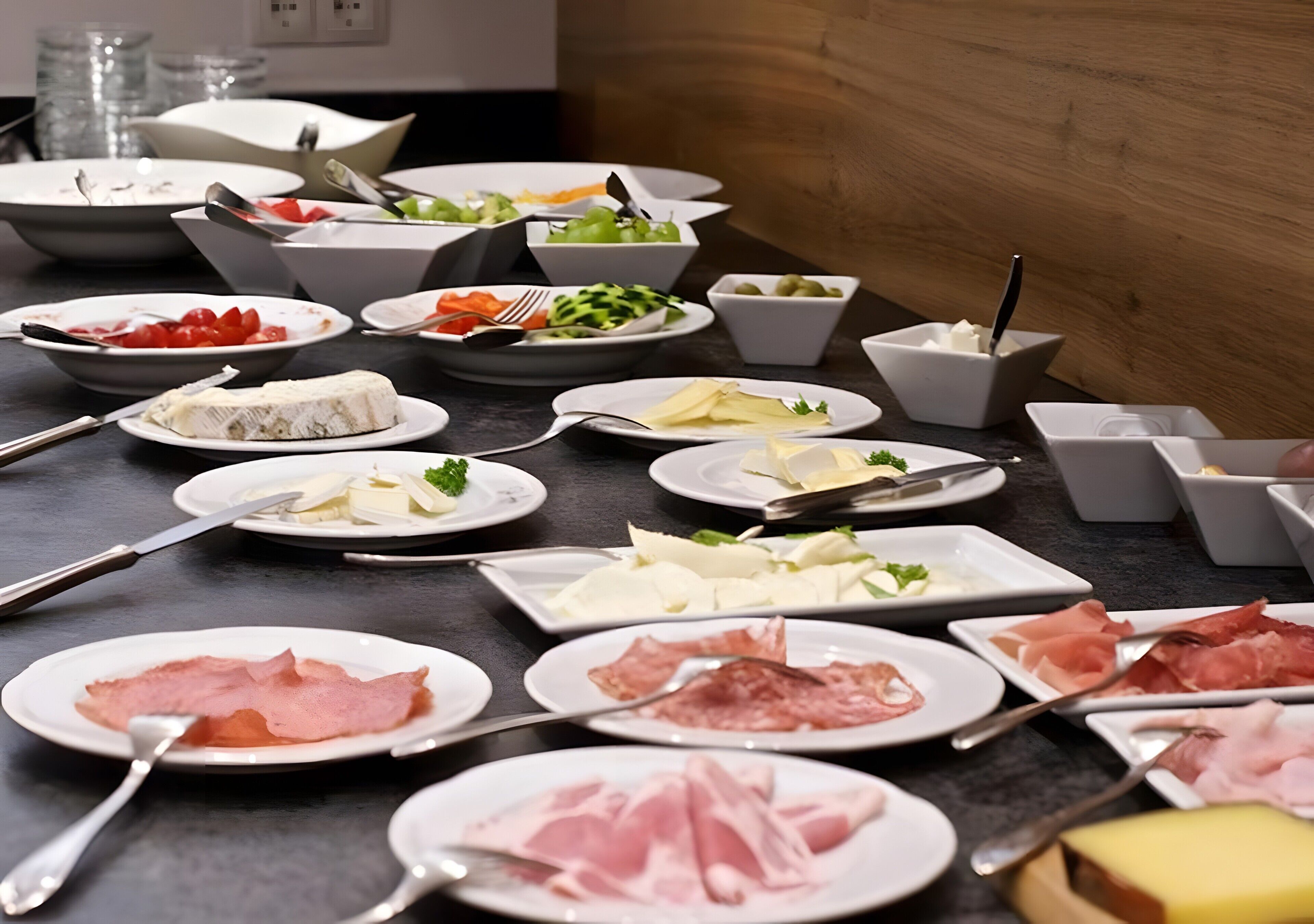 A table with various food items and utensils.