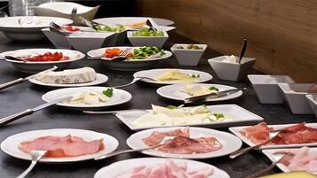 A table with various food items and utensils.