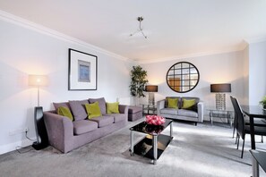 Apartment (3 Bedrooms) | Living area | 32-inch Smart TV with digital channels