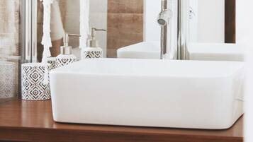 Shower, hair dryer, towels, toilet paper