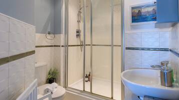 Shower, hair dryer, towels, shampoo