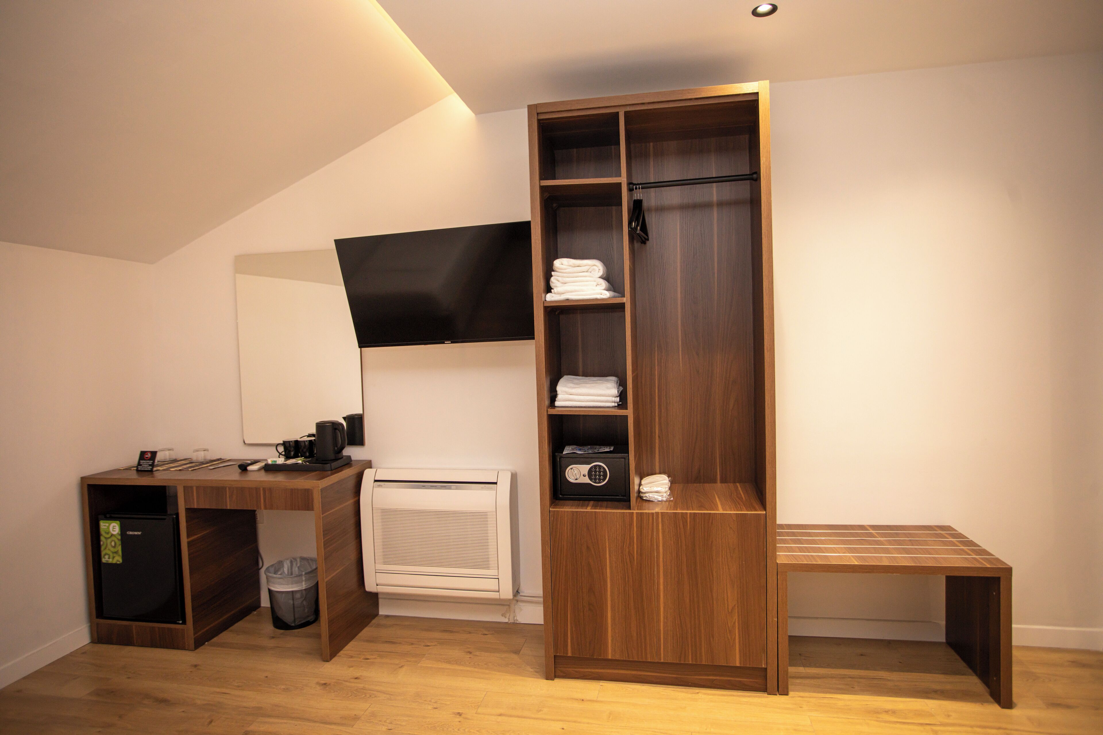 Deluxe Triple Room, City View | In-room safe, desk, laptop workspace, iron/ironing board