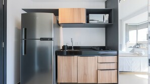 Fridge, microwave, stovetop, cookware/dishes/utensils