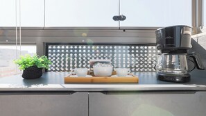 Fridge, microwave, stovetop, cookware/dishes/utensils