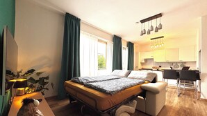 A modern bedroom with a bed, bedside table, and a small desk. - Lugano Lakeside: The Nest - your refuge in Castagnola (Lugano)