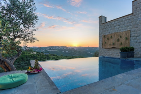 Seasonal outdoor pool, open 7:00 AM to midnight, pool umbrellas