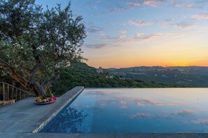 Seasonal outdoor pool, open 7:00 AM to midnight, pool umbrellas