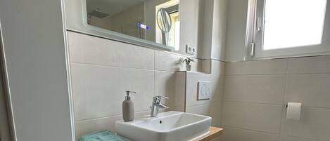 Shower, towels, toilet paper