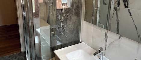 Shower, hair dryer, towels, soap