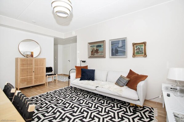 Premium Apartment, Balcony, City View | Living area | 40-inch flat-screen TV with cable channels, offices