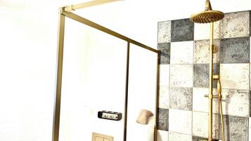 Shower, hair dryer, towels, toilet paper