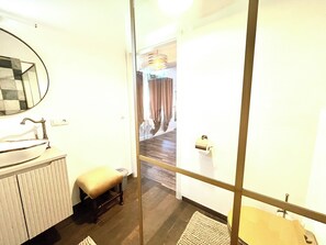 Shower, hair dryer, towels, toilet paper