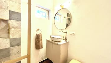 Shower, hair dryer, towels, toilet paper