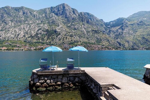 Historic waterfront house near Kotor with a private swimming pier