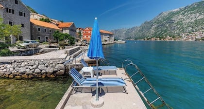 Historic waterfront house near Kotor with a private swimming pier