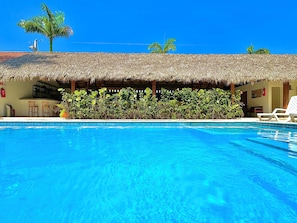 Outdoor pool, open 8:00 AM to 8:00 PM, pool umbrellas, pool loungers