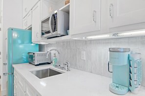 Fridge, microwave, coffee/tea maker, toaster