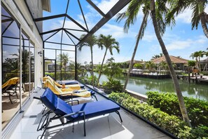 House, Multiple Beds (Beachy waterfront home with heated po) | Terrace/patio