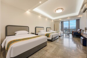 Senior Triple Room, City View | In-room safe, desk, laptop workspace, blackout curtains